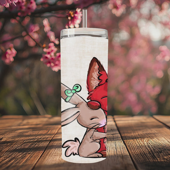 “Handmade 20oz skinny tumbler with hand-drawn choosing each other fox bunny – colorful, durable and double-walled for hot & cold drinks.”